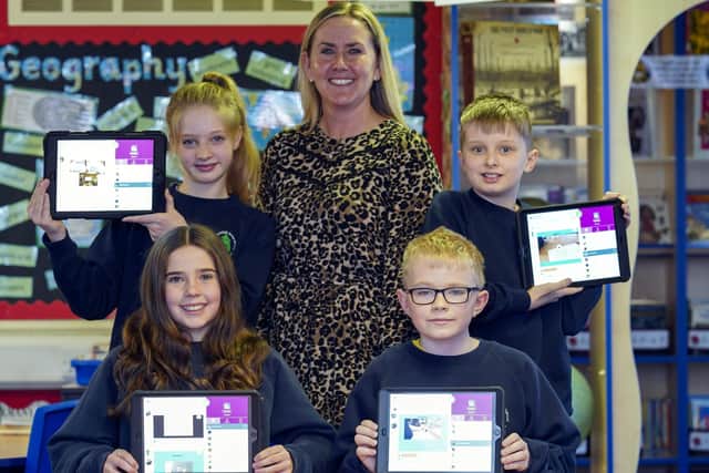 'Laptops for Everyone' dropped off just a handful of this week's devices at Stocksbridge Junior School. Head teacher Sam Gaymond with pupils Molly Hayward, Ellie Gaymond, Liam Whitworth and Flynn Micklethwaite.