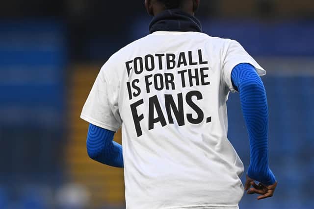 Brighton & Hove Albion players warmed up wearing t-shirts with a message in protest against the European Super League before playing Chelsea (Photo by Neil Hall - Pool/Getty Images)