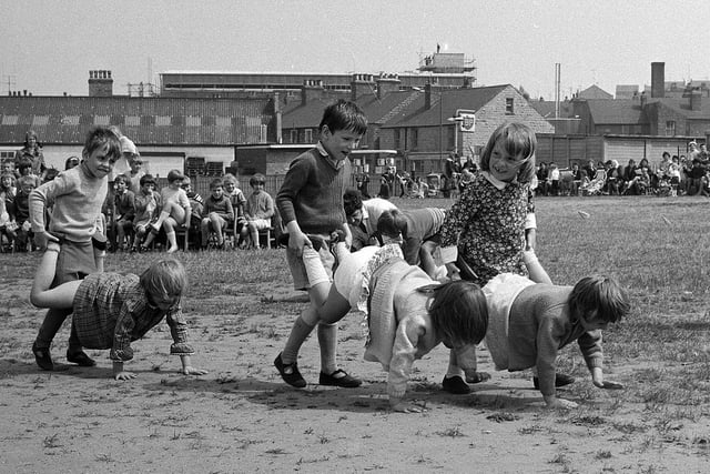 Look at the determination on their faces for their wheelbarrow race - recognise anyone you know?