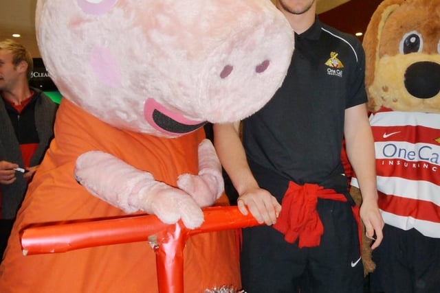 Gary Woods meets Peppa Pig in the Frenchgate centre during the Christmas light switch on in 2010