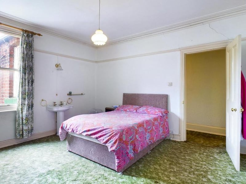 Bedroom - Single glazed timber framed window to the rear elevation, ceiling coving, picture rail, pedestal wash basin, wall light point, outset gas fire and power point.
