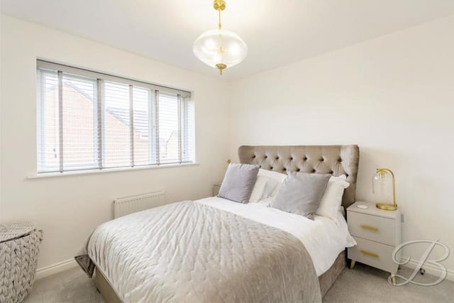It's not hard to like the master bedroom, which is cosy and contemporary. Fitted wardrobes are a plus, while the floor is carpeted and the window looks out the back of the house.