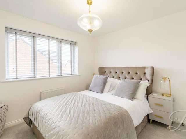 It's not hard to like the master bedroom, which is cosy and contemporary. Fitted wardrobes are a plus, while the floor is carpeted and the window looks out the back of the house.
