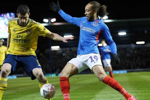 Portsmouth's Marcus Harness battles with Arsenal's Sokratis Papastathopoulos in the first half.