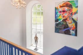 With artwork featuring David Bowie, the current owners of the listed building have blended historic and contemporary elements.