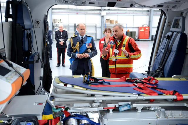 Prince Edward is shown the inside of the charity's new air ambulance.