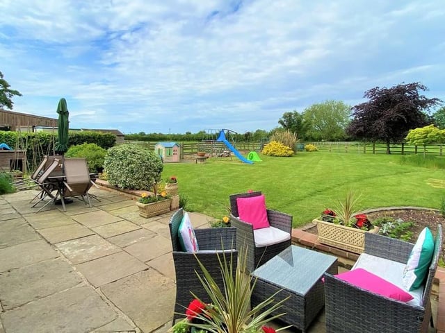 A nice York stone patio overlooking the fenced formal garden at the back of the property. The ideal place to spend a warm summer's evening.