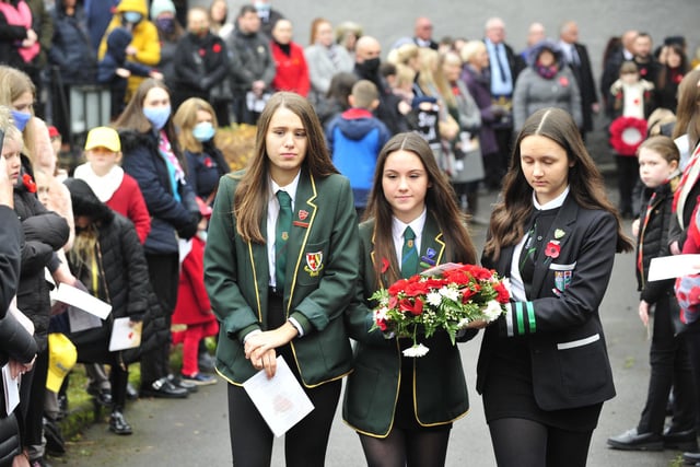 High school pupils lay a wreath at the war memorial in Bonnybridge