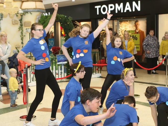 The dancers from Queen Elizabeth School school drop into the Four Seasons Shopping Centre and performed outside Topman in 2019
