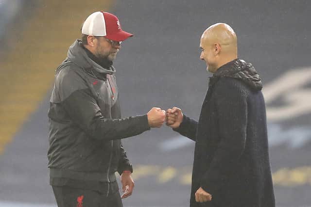 Liverpool boss Jurgen Klopp and Manchester City's Pep Guardiola are putting on a united front in their quest to have five substitutions introduced to the Premier League. (Photo by Martin Rickett - Pool/Getty Images)