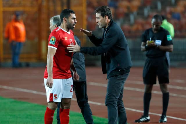 Ahly's Swiss manager Rene Weiler (C) instructs his defender and captain Ahmed Fathy (L) during the first leg of the CAF Champions League Quarter-final football match between Egypt's Al-Ahly and South Africa's Mamelodi Sundowns at Cairo International Stadium: KHALED DESOUKI/AFP via Getty Images)