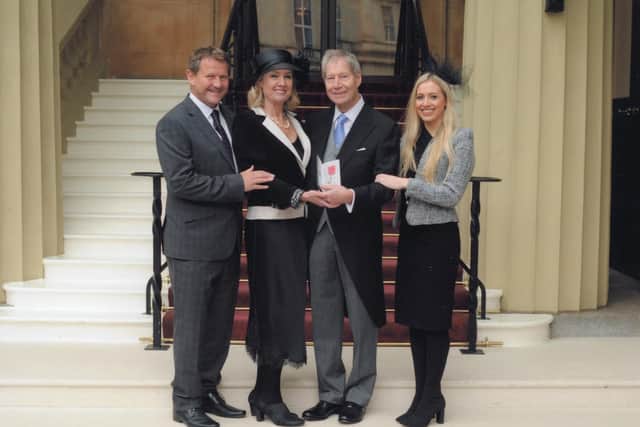 Barrie Cottingham receiving his MBE at Buckingham Palace with, left to right, son Nigel, wife Nicola and stepdaughter Sophie