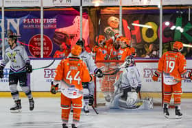 Sheffield Steelers players celebrate a goal at Manchester