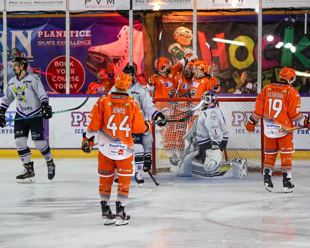 Sheffield Steelers players celebrate a goal at Manchester