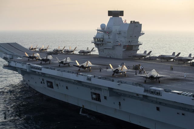 HMS Queen Elizabeth has embarked two squadrons of F-35B stealth jets: the UK's 617 Sqn and US Marine Corps fighter attack squadron 211. Alongside eight Merlin helicopters, it is the largest air group to operate from a Royal Navy carrier in more than thirty years, and the largest air group of fifth generation fighters at sea anywhere in the world.