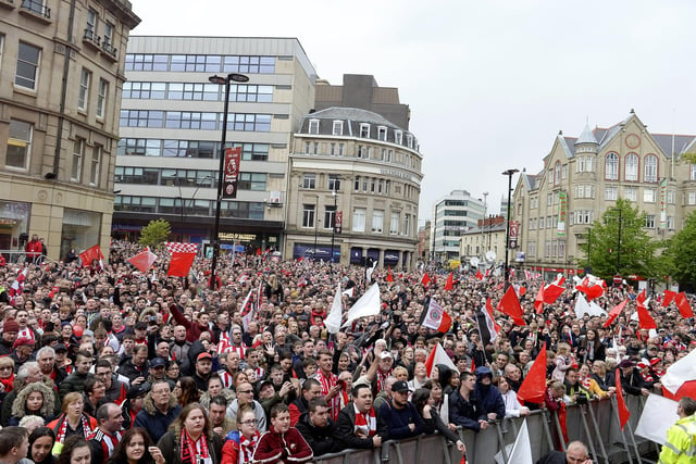 Sheffield United fans line the streets to celebrate their promotion to the Premier League at Sheffield Town Hall, May 7, 2019