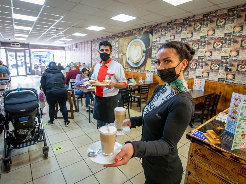 Staff Shagl Osman and manager Khaled Sleman excited to serve indoors in cafe Nut, North End, Portsmouth. Picture: Habibur Rahman
