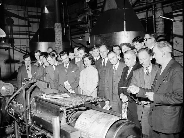 The Edinburgh Publicity Club visiting The Scotsman offices in March 1960. Employee Mr Hamilton is pictured explaining how the 'auto-shaving machine' works.