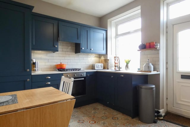The newly fitted kitchen is described by the Strike brochure as stylish.