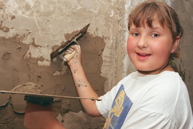 11 years old  Leanne Houghhland, St John's Primary School Penistone pupil, tried plastering at the College open day