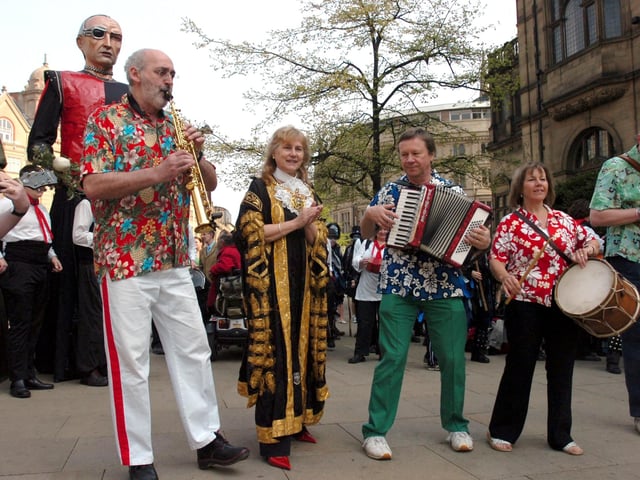 Sheffield's 2006-7 Lord Mayor Coun Jackie Drayton with musicians outside the town hall, watching dancers celebrate St George's Day