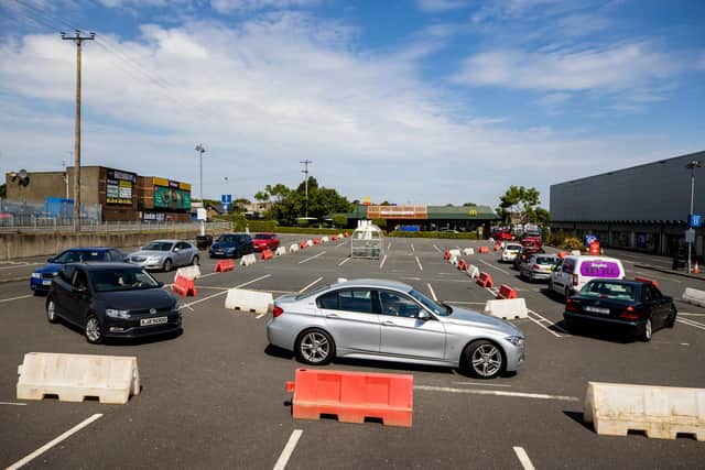 A queue of cars at the reopened McDonald's drive-thru at Bloomfield Shopping Mall in Bangor - Liam McBurney/PA Wire