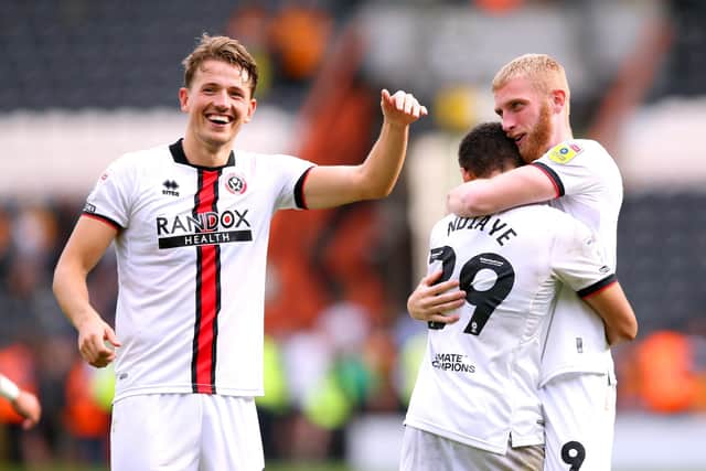 Sheffield United's Sander Berge gives Iliman Ndiaye and Oli McBurnie (right) the thumbs up: Nigel French/PA Wire.