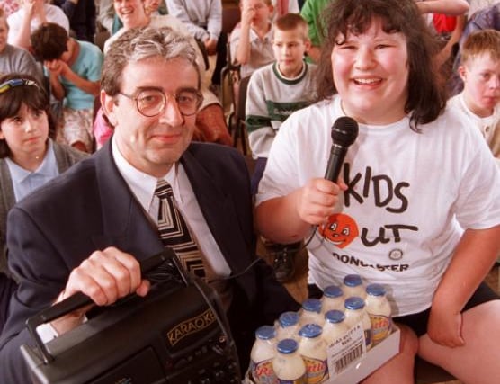 Mike Davies presented a kareoke machine to competition winner, Louise Crundell aged 14 in 1996, at Fernbank Special School