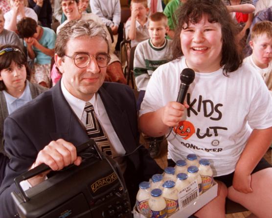 Mike Davies presented a kareoke machine to competition winner, Louise Crundell aged 14 in 1996, at Fernbank Special School