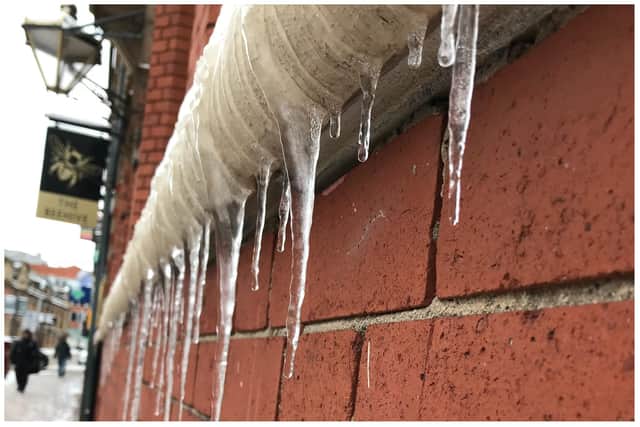 Icicles hang off the windowsill of a property on West Street in Sheffield city centre