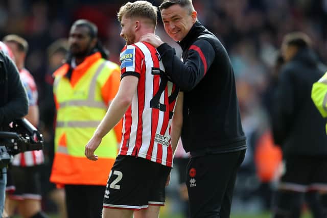 Sheffield United's Tommy Doyle and manager Paul Heckingbottom after the Emirates FA Cup quarter final match at Bramall Lane: Nigel French/PA Wire.