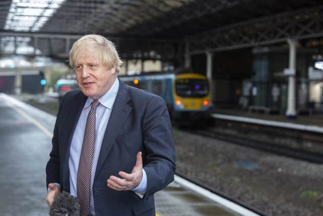 Prime Minister Boris Johnson visit Huddersfield Train Station, West Yorks, as he announces as he answers questions on HS2.