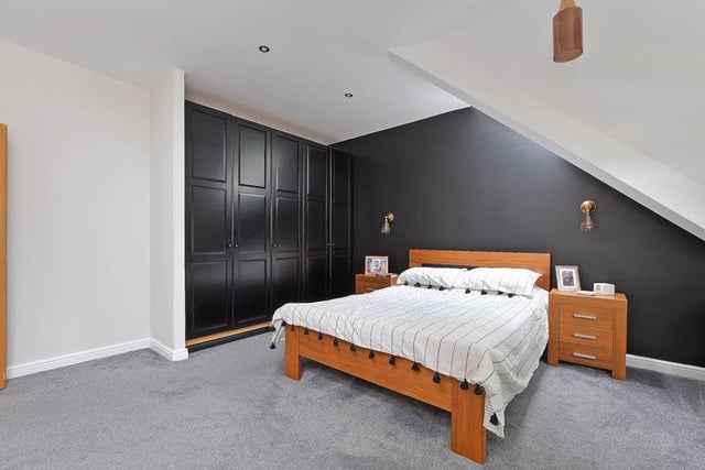 The main bedroom comes with a set of fitted wardrobes.