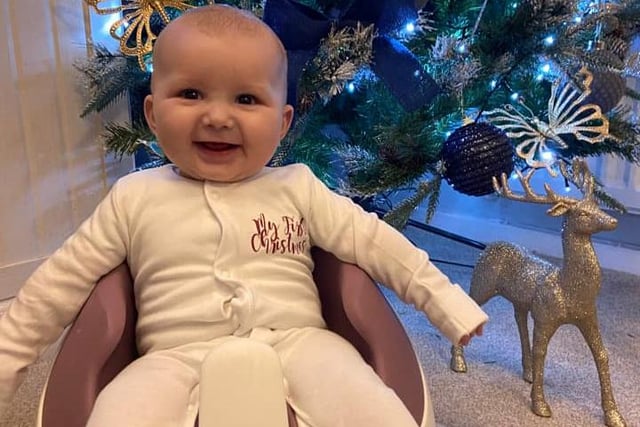 A lovely smile from Solomon for his first Christmas.