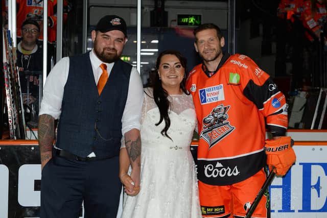 Sheffield Steelers fans Emily and Joshua Hurst got married on Saturday and six hours later were at Sheffield Arena for the match against Coventry Blaze. Picture: Dean Woolley