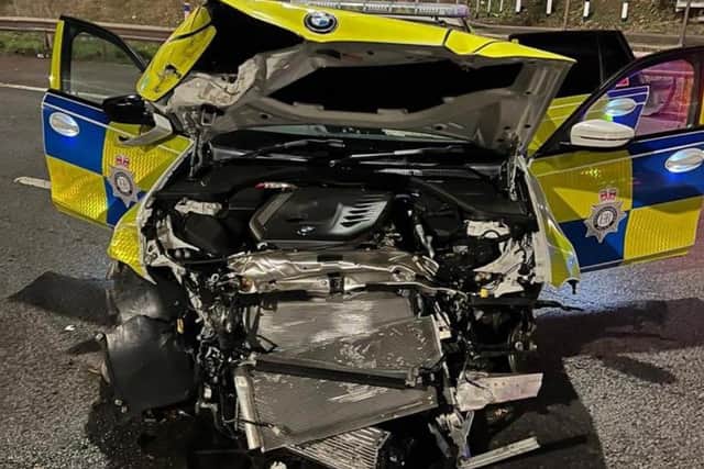 A mangled police car after it was rammed during a chase on the M1 which ended in South Yorkshire (pic: Leicestershire Roads Policing Unit)