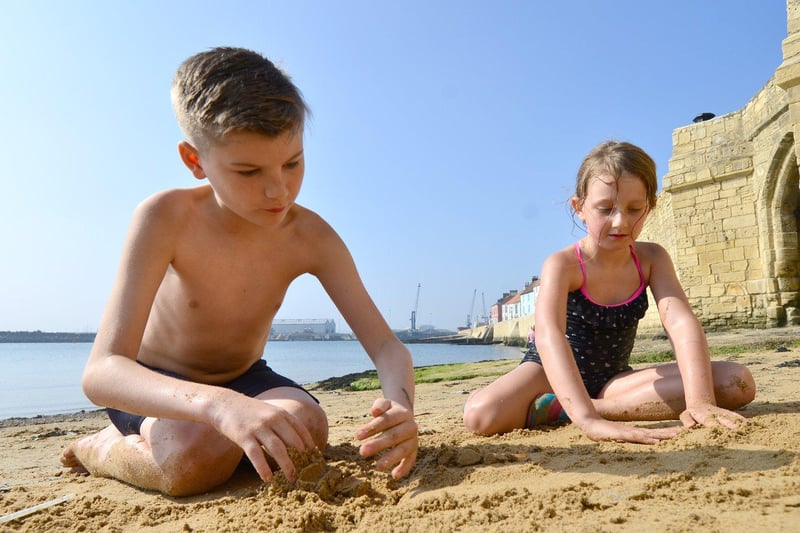 Nathan Wilson and Bonnie Gordon starting to build a sandcastle at Fish Sands Headland, Hartlepool.
