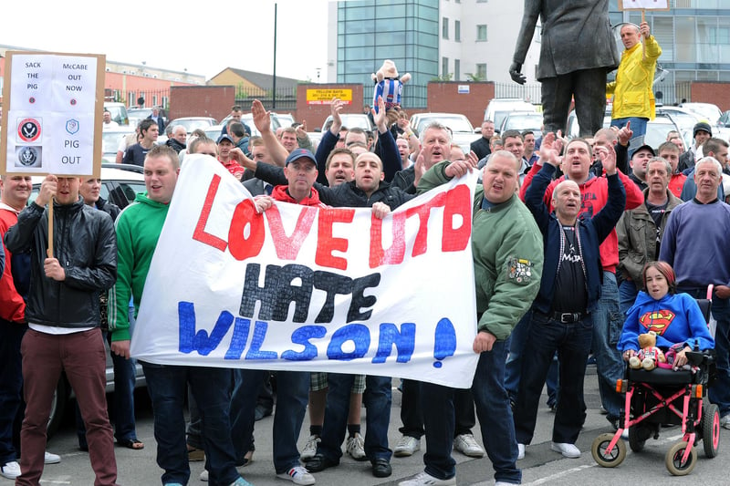 Angry United fans protest around the Derek Dooley statue at Bramall Lane after Danny Wilson was appointed as the club's new manager