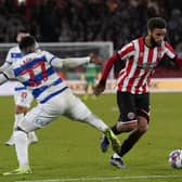 Jayden Bogle of Sheffield United skips past Ethan Laird of QPR on his return from injury: Andrew Yates / Sportimage