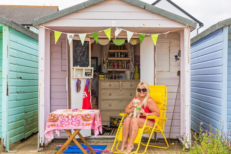 Beach hut lover Jan Norman and dog Billy make the most of the return to summer temperatures. Picture: Mike Cooter (150721)