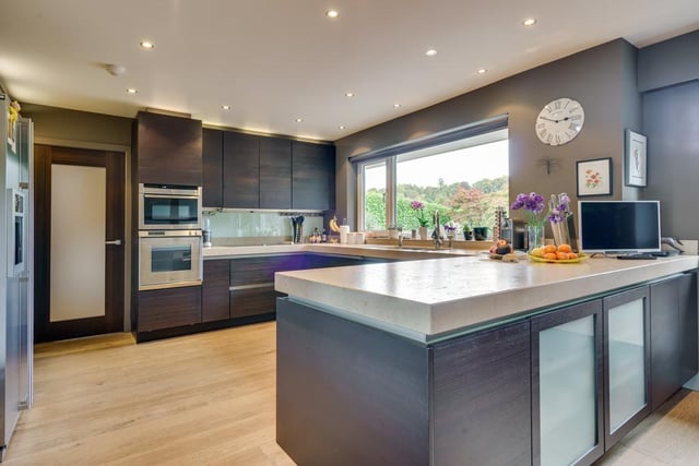 The property boasts a fitted SieMatic kitchen with a unique style. The wooden flooring is complemented by the natural limestone on the counter tops.