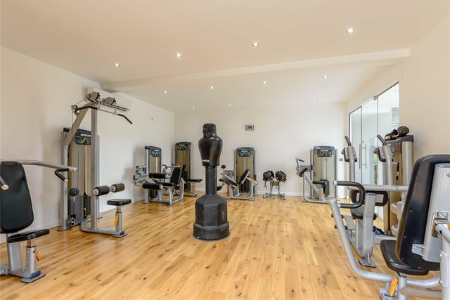 The fully equipped home gym is large enough to accommodate numerous machines, but could also be used as an additional reception room or home office.