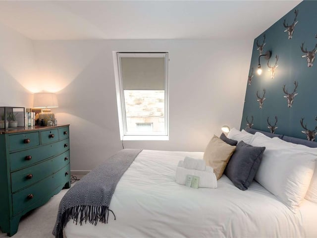 The flat has a double bedroom with a south-west facing window
