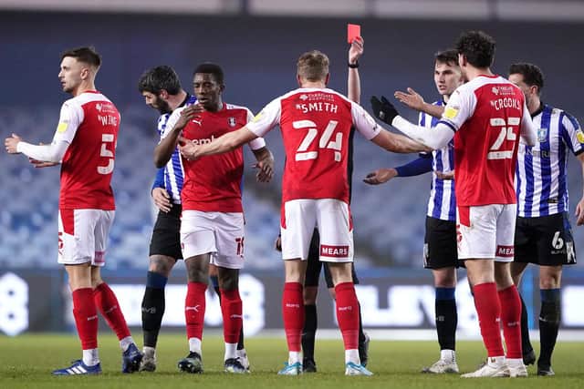 Rotherham United's Michael Smith (centre) reacts as he is shown a red card against Sheffield Wednesday during the Sky Bet Championship match at Hillsborough. Zac Goodwin/PA Wire.