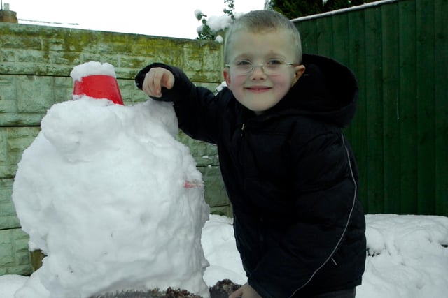 Ryan Washbourn, six, enjoyed a day off school at his home in Barnby Dun, Doncaster, by building snowmen and throwing snowballs in 2010. Photo by Sarah Washbourn.