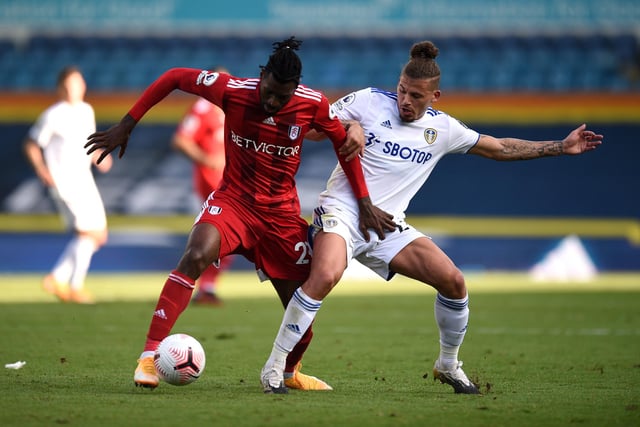 Andre-Frank Zambo Anguissa of Fulham battles for possession with  Kalvin Phillips.