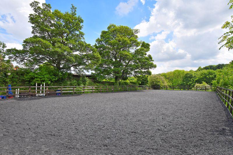 The equestrian area includes a manege, an enclosed area for training horses and riders.