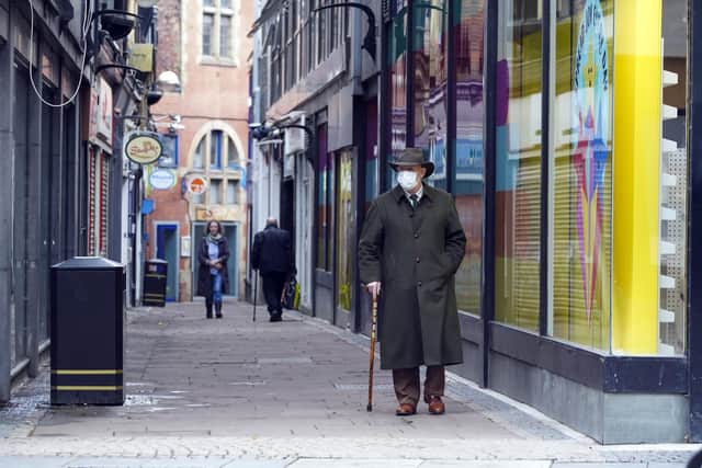 A person wearing a mask in Sheffield city centre. Picture Scott Merrylees