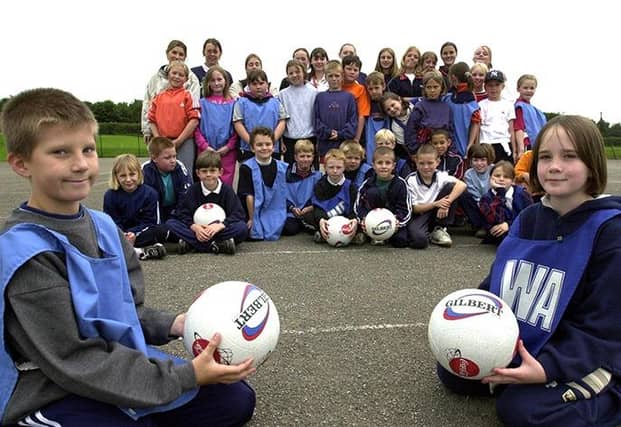 Primary school pupils who took part in the netball coaching at Birley School, with foreground, Thomas Childs and Abigail Dubieniec (both 9) on July 12, 2000