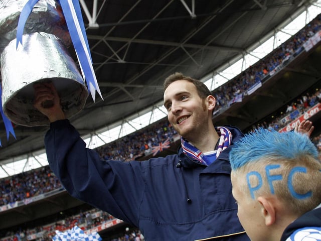 A Pompey fan awaits the kick-off inside Wembley.